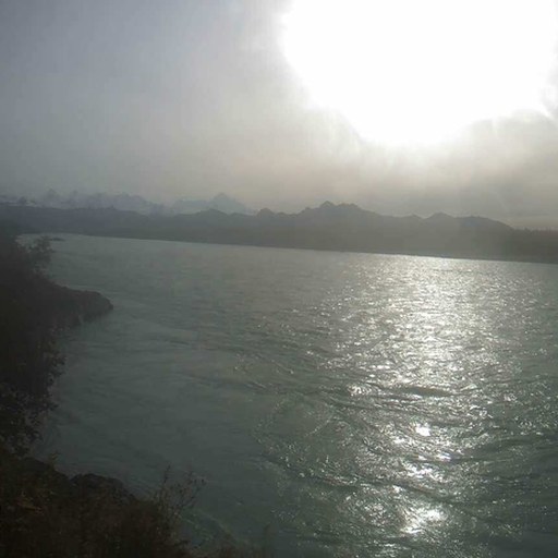 Input: a hazy river with hidden mountains.