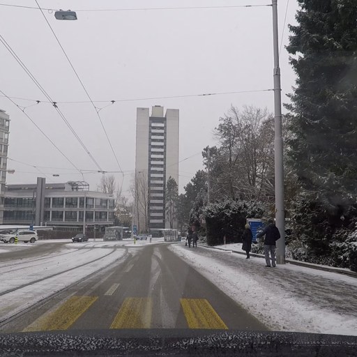 Input: a snowy street crossing.